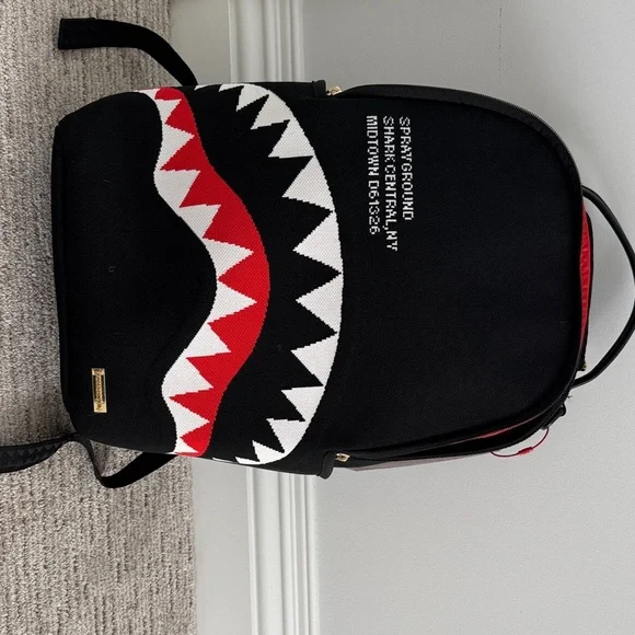 Sprayground Black Backpack with Vibrant Red Interior - Picture 1 of 6